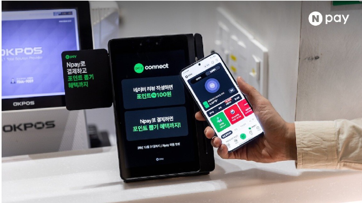 Image of a customer tapping a smartphone to pay at a Naver Pay "Connect" terminal